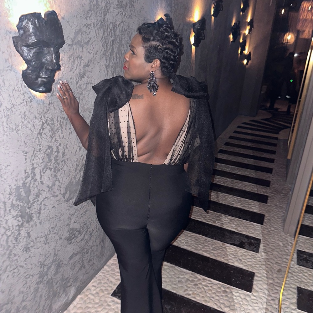 Black Jumpsuit with the back out. ASOS collection size 16 very pretty.